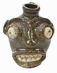 Edgefield face jug, dark glaze